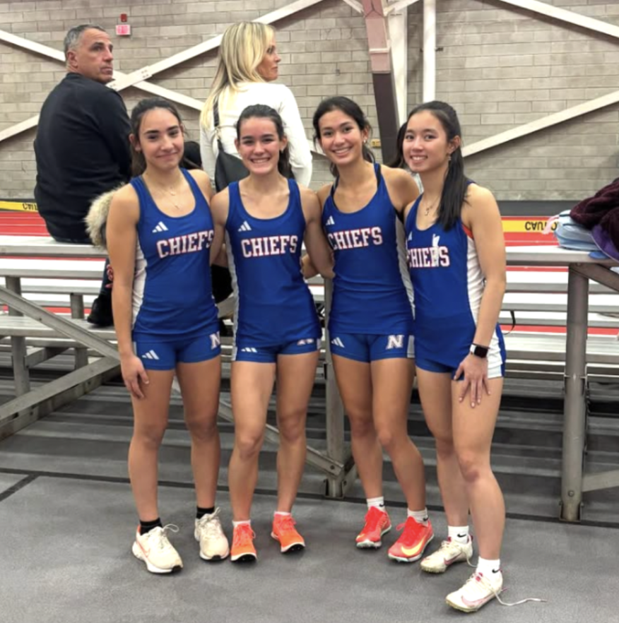 From left, freshman Gianna Perugini, freshman Maddie Garguilo, junior Sophia Garguilo and senior captain Ellie McDonald pose after breaking two school records earlier this season. (Courtesy of NHS Track and Field/Instagram)